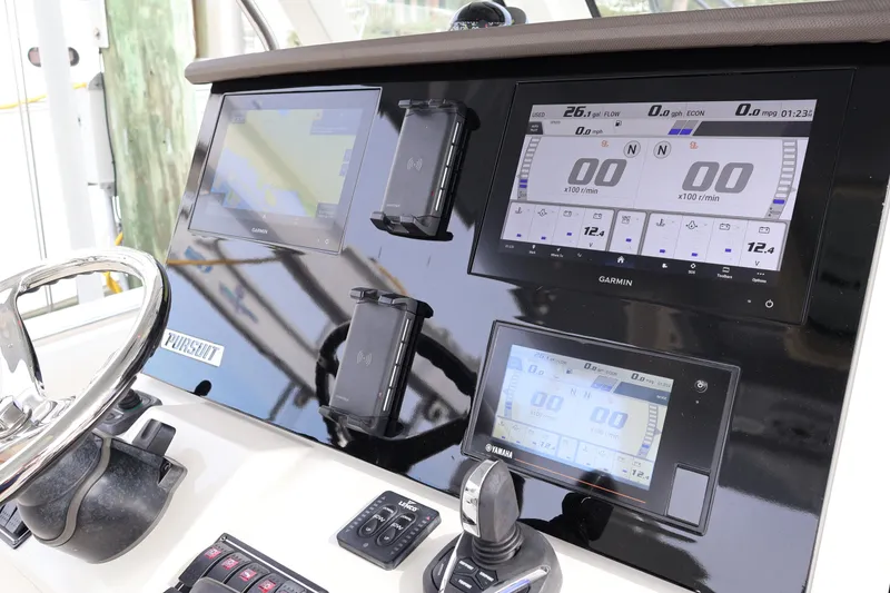 Slide: The Image of 2021 Pursuit S 328 Sport dashboard with Garmin navigation and control displays. - 18