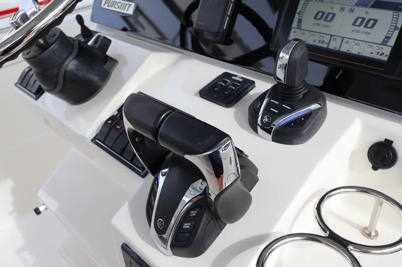 Slide: The Image of 2021 Pursuit S 328 Sport boat controls and dashboard with modern navigation equipment. - 20
