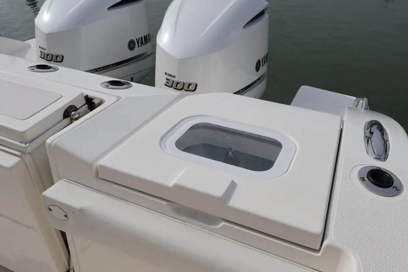 Slide: The Image of 2021 Pursuit S 328 Sport boat with Yamaha 300 engines, featuring a sleek deck design. - 28