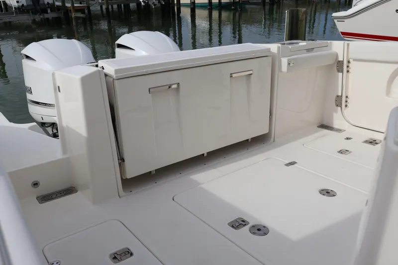 Slide: The Image of 2021 Pursuit S 328 Sport boat deck with dual Yamaha outboard engines. - 34