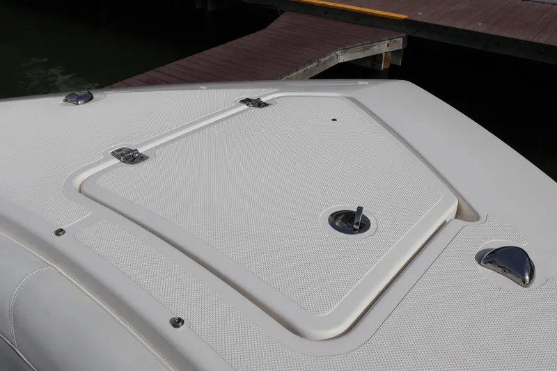 Slide: The Image of 2021 Pursuit S 328 Sport boat deck with hatch and cleats. - 51