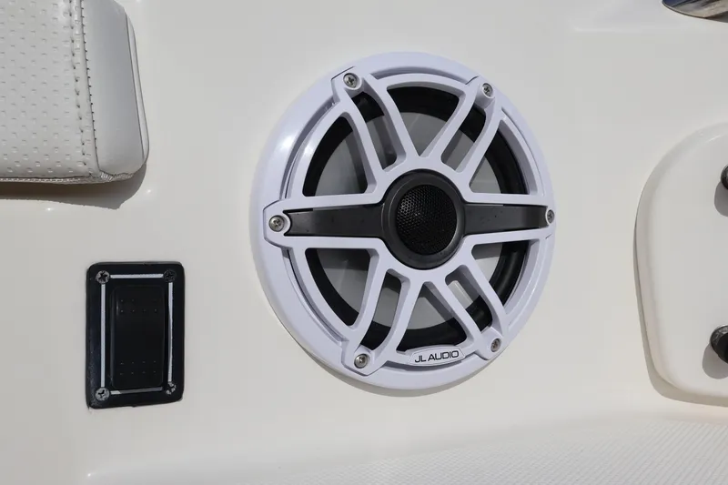 Slide: The Image of JL Audio speaker on 2021 Pursuit S 328 Sport boat interior. - 53