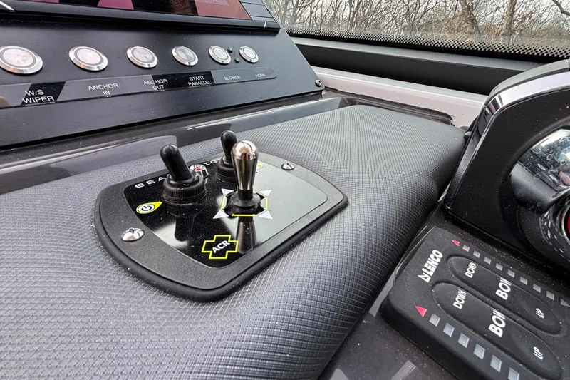 Slide: The Image of Control panel of 2026 Monterey 385 Super Express boat with switches and buttons. - 19