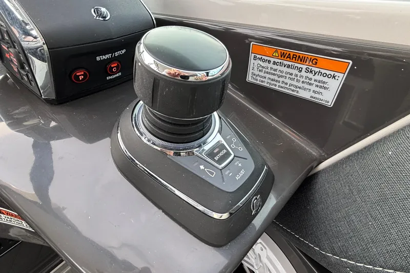 Slide: The Image of Joystick control panel on 2026 Monterey 385 Super Express boat dashboard. - 21
