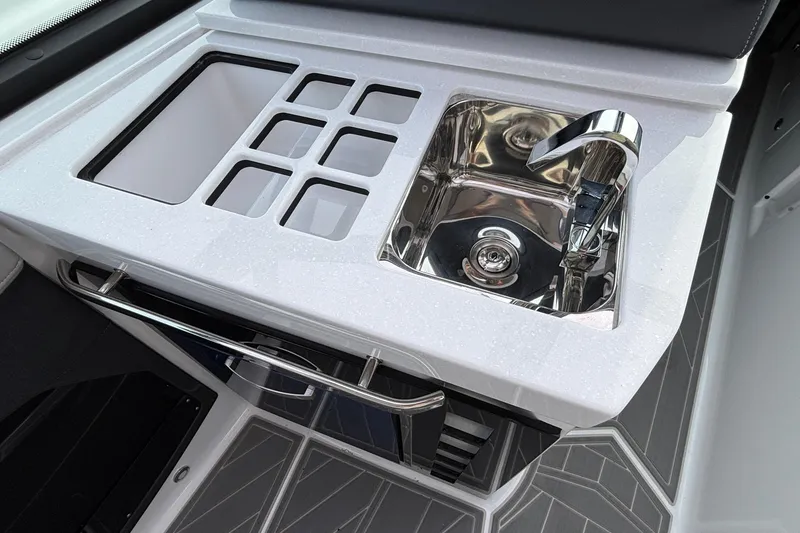 Slide: The Image of 2026 Monterey 385 Super Express boat sink and countertop with modern design. - 28