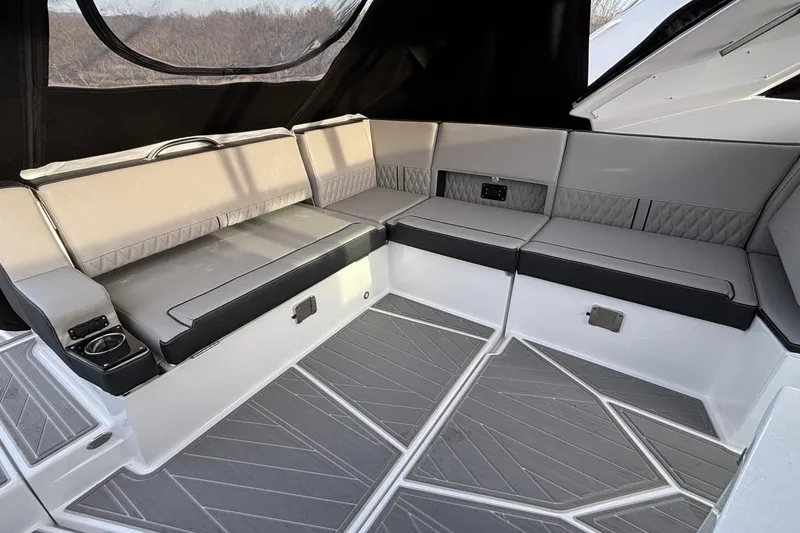 Slide: The Image of Luxurious seating area in 2026 Monterey 385 Super Express boat interior. - 38