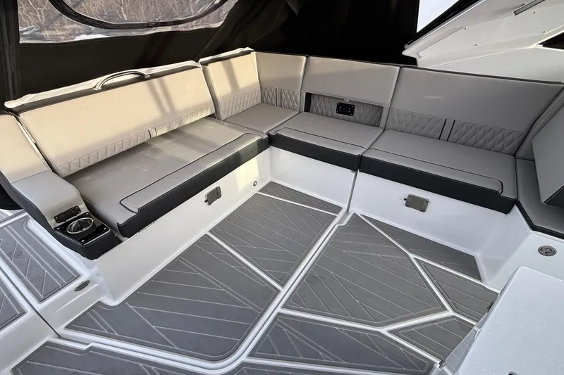 Slide: The Image of Luxurious seating area on 2026 Monterey 385 Super Express boat with modern design and gray upholstery. - 39