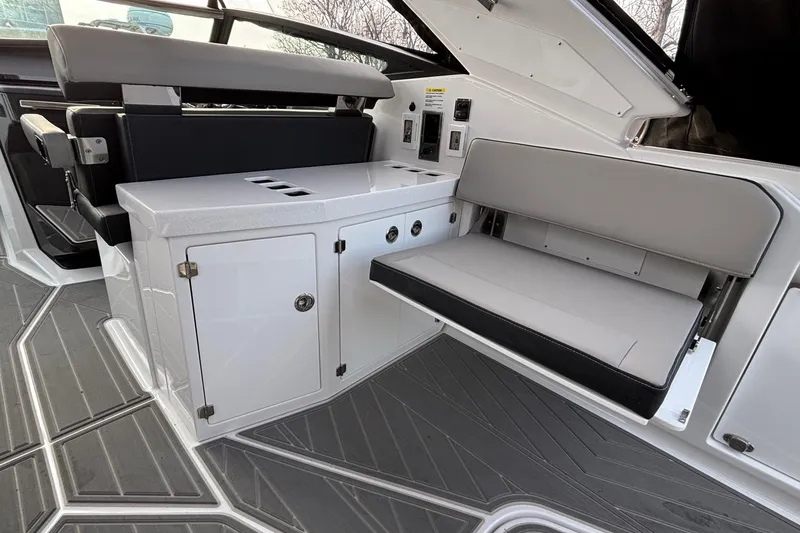Slide: The Image of Interior of 2026 Monterey 385 Super Express boat with seating and storage. - 40