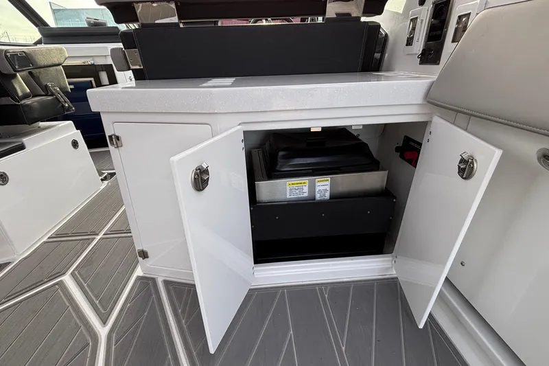 Slide: The Image of 2026 Monterey 385 Super Express interior with open storage compartment and modern design. - 42