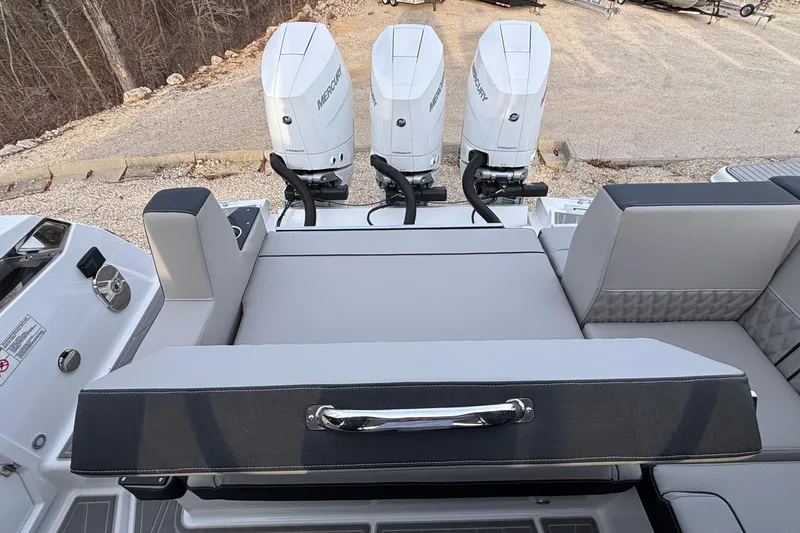 Slide: The Image of 2026 Monterey 385 Super Express boat with triple Mercury engines and luxurious seating. - 46