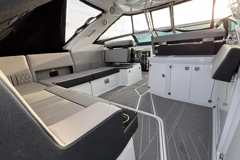 Slide: The Image of Interior of 2026 Monterey 385 Super Express yacht, featuring luxurious seating and modern design. - 5