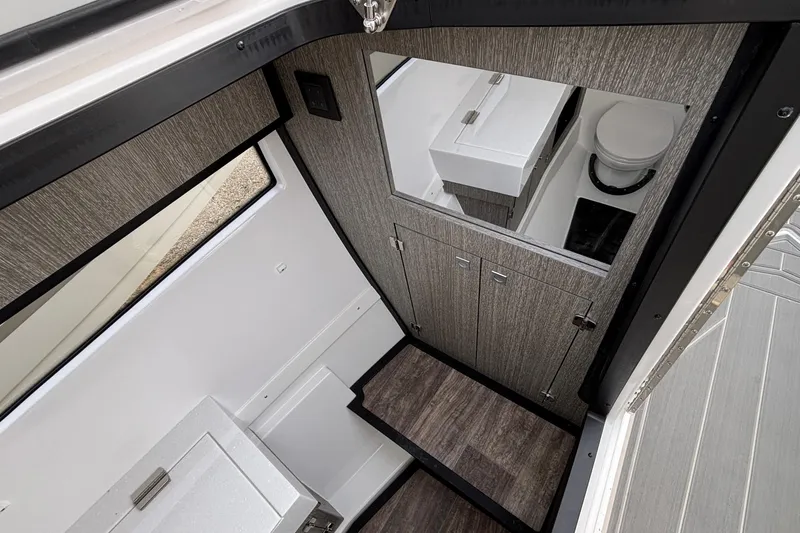 Slide: The Image of Interior of 2026 Monterey 385 Super Express boat, featuring modern bathroom design. - 57
