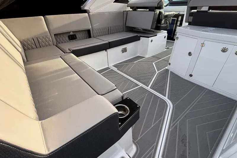 Slide: The Image of Luxurious interior of 2026 Monterey 385 Super Express boat with sleek seating and modern design. - 6