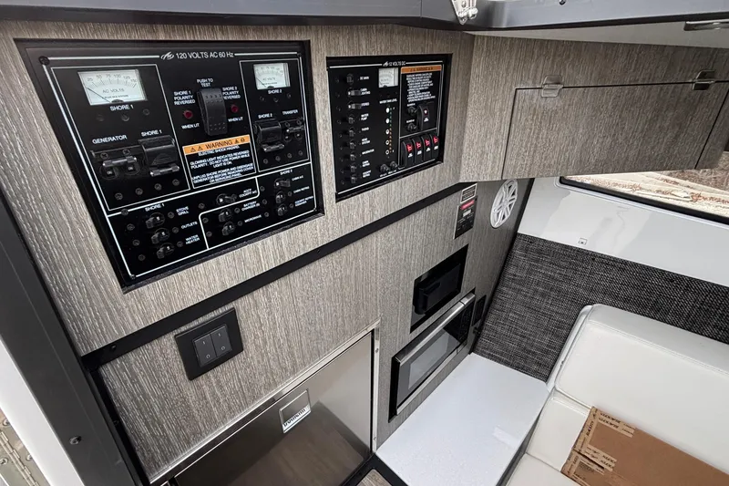 Slide: The Image of Control panel and interior of 2026 Monterey 385 Super Express boat. - 60