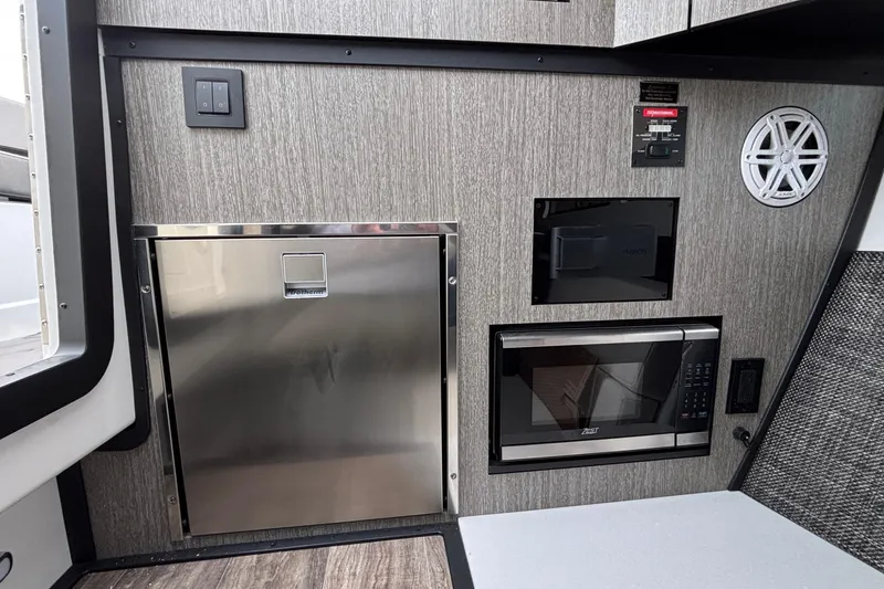 Slide: The Image of Interior of 2026 Monterey 385 Super Express with modern appliances and sleek design. - 63