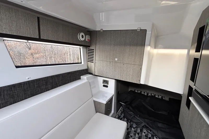 Slide: The Image of 2026 Monterey 385 Super Express cabin interior with modern seating and cabinetry. - 65