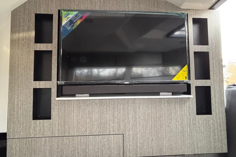 Slide: The Image of Entertainment center with TV in 2026 Monterey 385 Super Express yacht interior. - 67