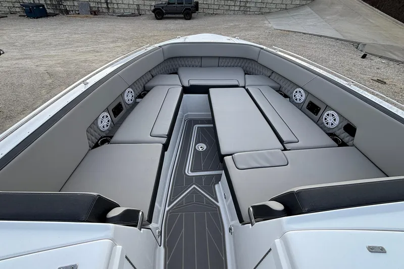 Slide: The Image of 2026 Monterey 385 Super Express boat interior with luxurious seating and integrated speakers. - 72