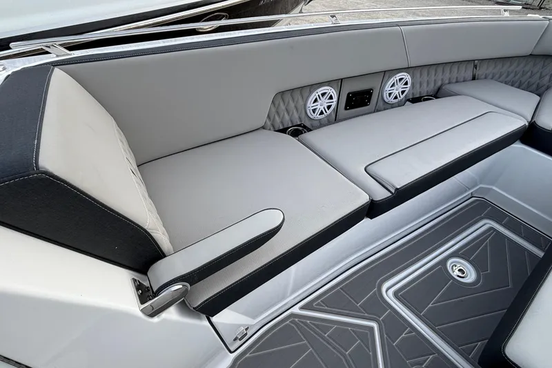 Slide: The Image of Luxurious seating area on 2026 Monterey 385 Super Express boat with speakers and armrest. - 73