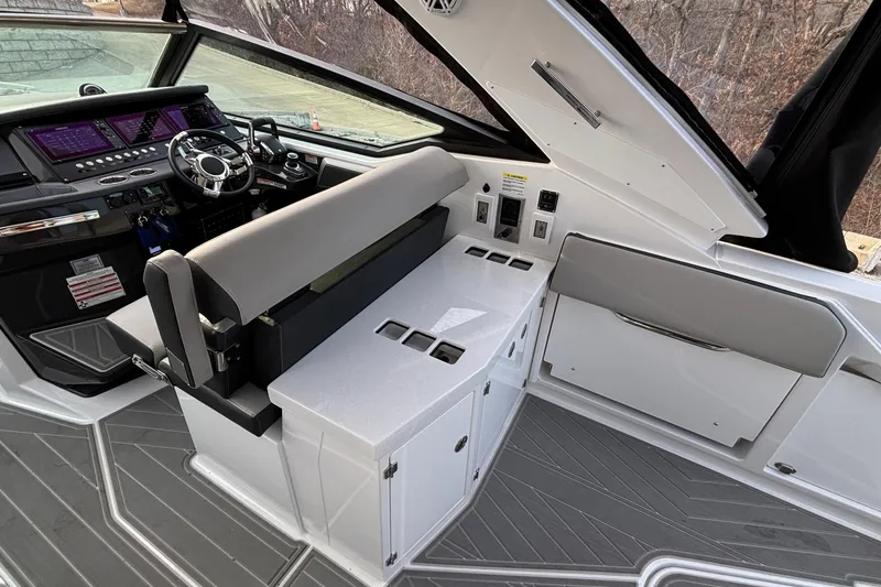 Slide: The Image of 2026 Monterey 385 Super Express cockpit with modern controls and sleek seating. - 9