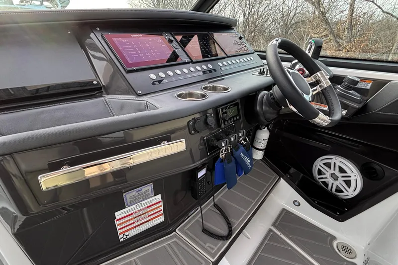 Slide: The Image of 2026 Monterey 385 Super Express helm with advanced controls and sleek design. - 13