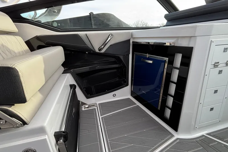 Slide: The Image of Interior of 2026 Monterey 385 Super Express boat with seating and storage features. - 23