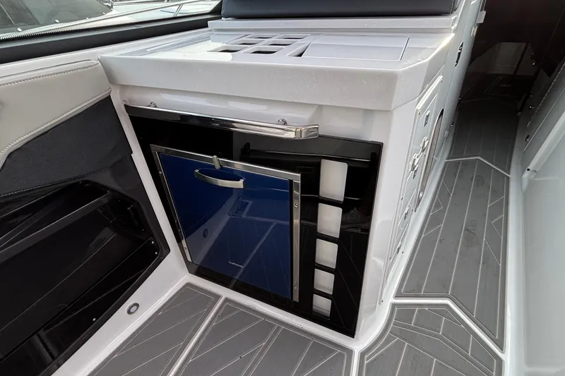 Slide: The Image of Interior of 2026 Monterey 385 Super Express yacht with sleek cabinetry and modern flooring. - 26