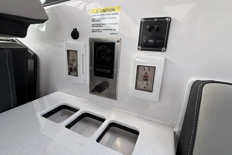 Slide: The Image of Control panel on 2026 Monterey 385 Super Express boat with outlets and switches. - 43