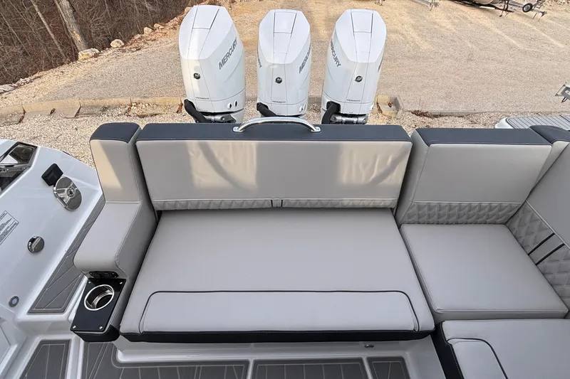 Slide: The Image of 2026 Monterey 385 Super Express boat with triple Mercury engines and luxurious seating. - 47