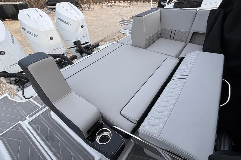 Slide: The Image of 2026 Monterey 385 Super Express boat with luxurious seating and Mercury Verado engines. - 52