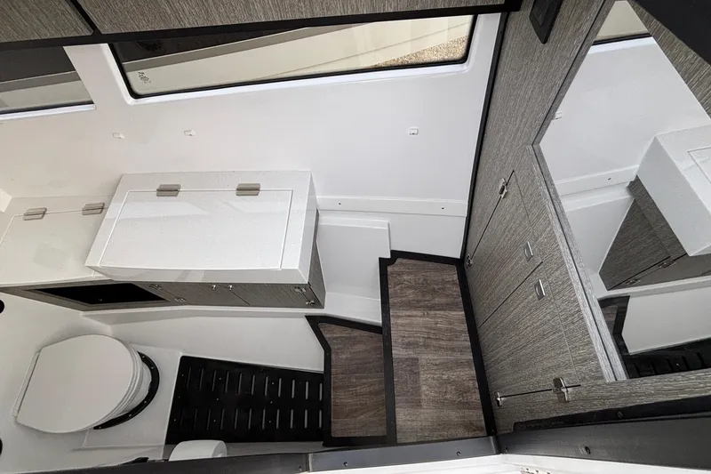 Slide: The Image of Interior of 2026 Monterey 385 Super Express boat, featuring modern bathroom design. - 55