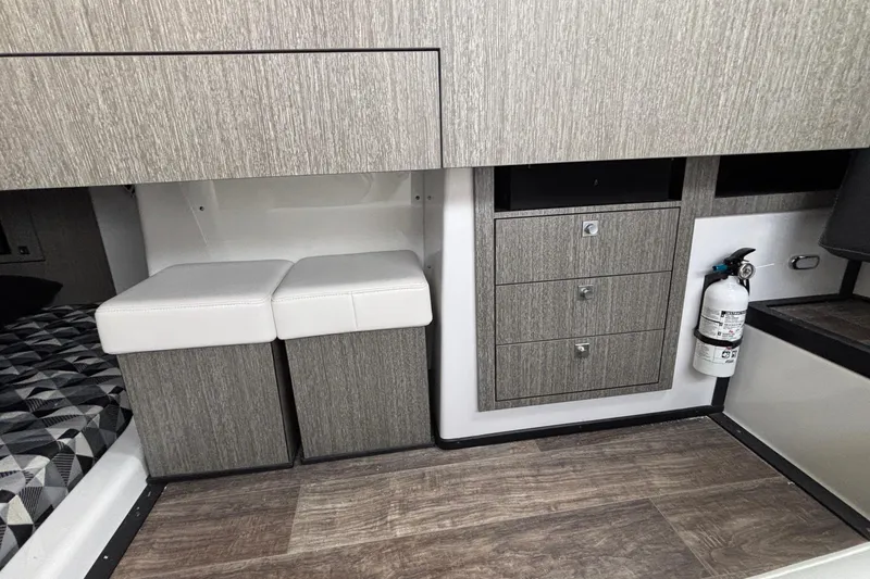 Slide: The Image of Interior of 2026 Monterey 385 Super Express with modern cabinetry and seating. - 66