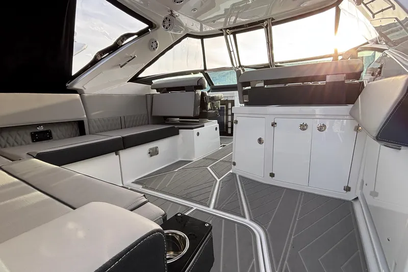 Slide: The Image of Luxurious interior of 2026 Monterey 385 Super Express yacht with modern seating and cabinetry. - 7