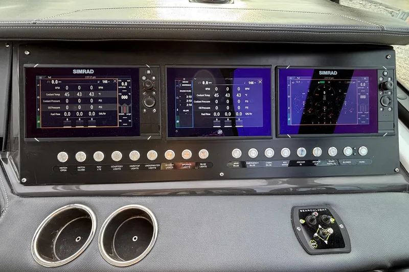 Slide: The Image of Dashboard of 2026 Monterey 385 Super Express with Simrad navigation displays. - 8