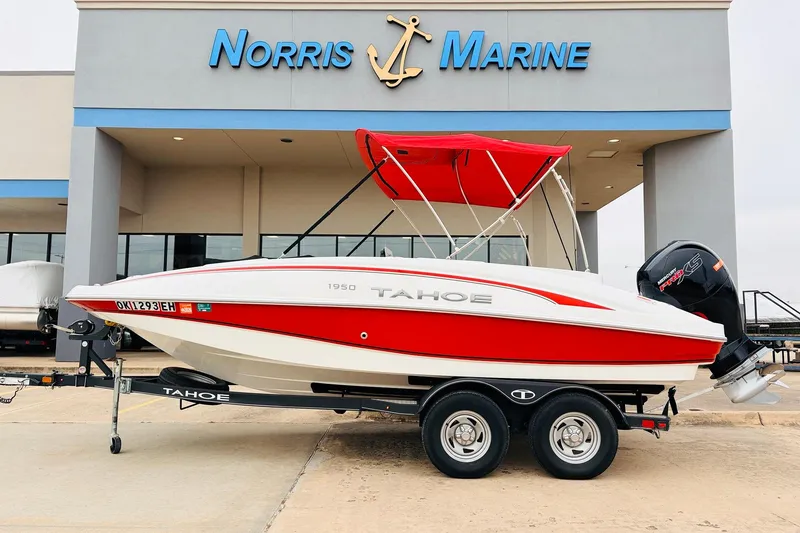 The Image of 2021 Tahoe 1950 boat with red canopy at Norris Marine dealership. - 1