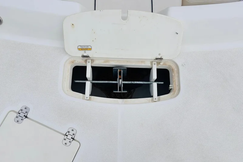 Slide: The Image of Open anchor compartment on 2021 Tahoe 1950 boat deck. - 12