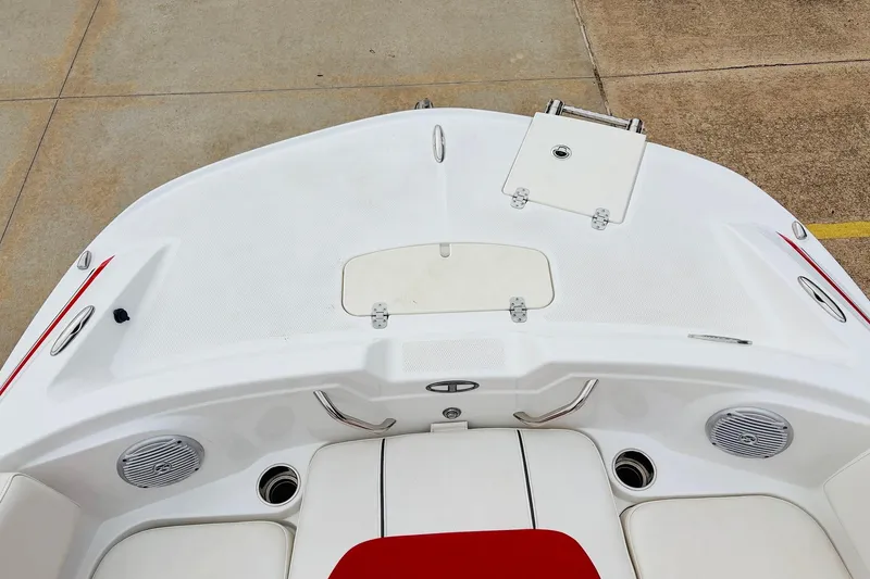 Slide: The Image of 2021 Tahoe 1950 boat deck with white seating and red accents. - 13