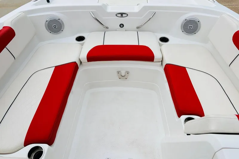 Slide: The Image of Interior of 2021 Tahoe 1950 boat with red and white seating. - 15