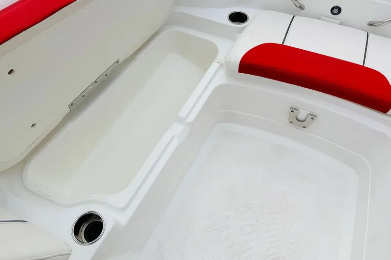 Slide: The Image of White and red interior of a 2021 Tahoe 1950 boat, featuring seating and storage. - 17