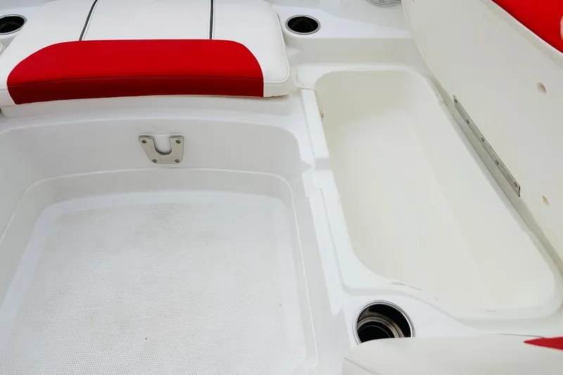Slide: The Image of Interior of 2021 Tahoe 1950 boat with red and white seating. - 18