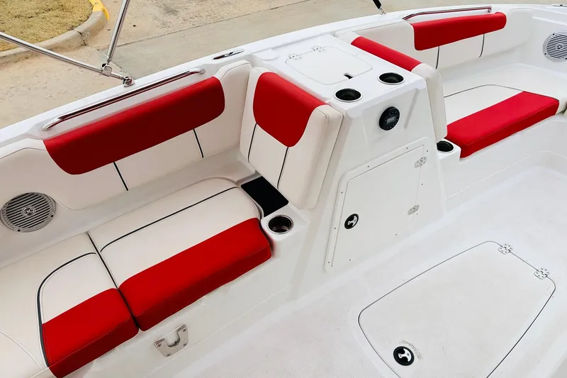 Slide: The Image of Interior of a 2021 Tahoe 1950 boat with red and white seating. - 23