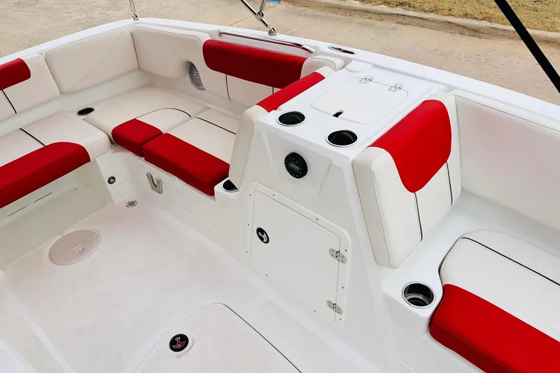 Slide: The Image of Interior of 2021 Tahoe 1950 boat with red and white seating. - 24