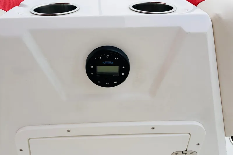 Slide: The Image of Dashboard of a 2021 Tahoe 1950 boat with Jensen stereo system. - 25