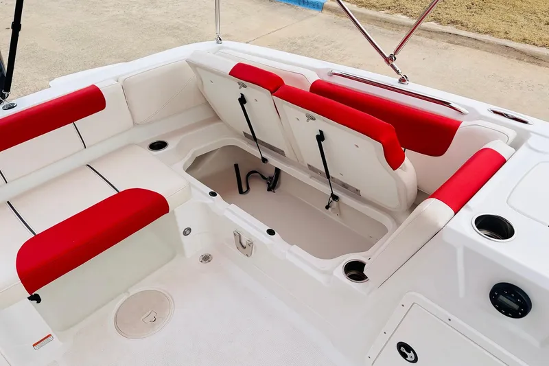 Slide: The Image of Interior of 2021 Tahoe 1950 boat with red and white seating and storage compartment. - 30