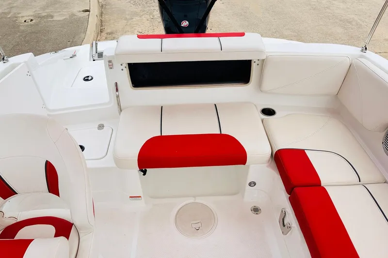 Slide: The Image of Interior of 2021 Tahoe 1950 boat with red and white seating. - 33