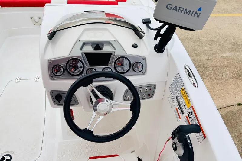 Slide: The Image of Steering console of 2021 Tahoe 1950 boat with Garmin navigation system. - 36