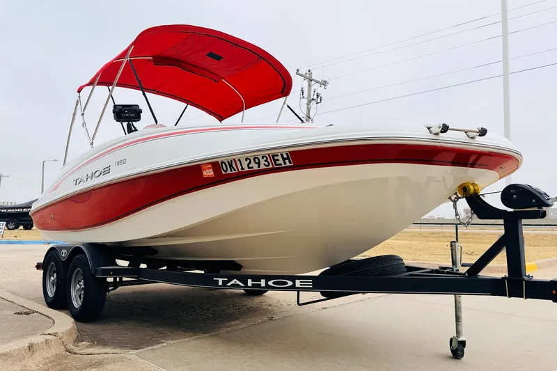 Slide: The Image of Red and white 2021 Tahoe 1950 boat on trailer with canopy. - 4