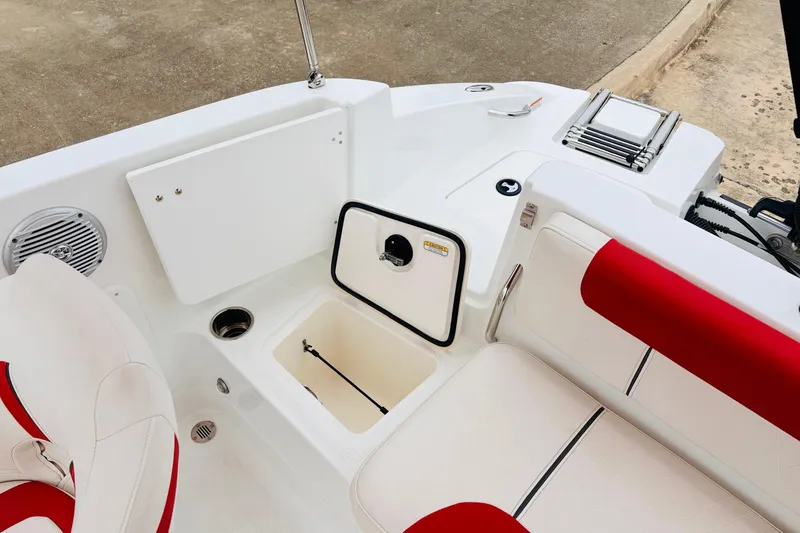 Slide: The Image of Interior of a 2021 Tahoe 1950 boat with red and white seating. - 42