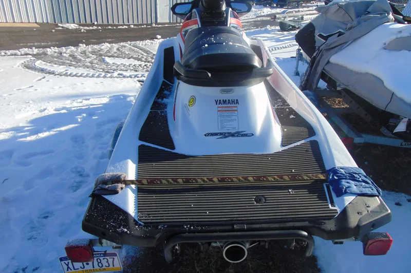 Slide: The Image of 2016 Yamaha WaveRunner VXR on snowy ground, rear view with license plate visible. - 7