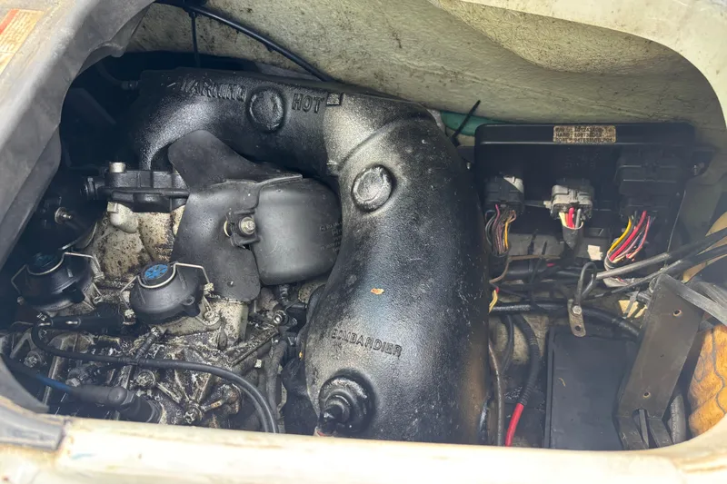 Slide: The Image of 2002 Sea-Doo GTX DI engine compartment with visible components and wiring. - 6